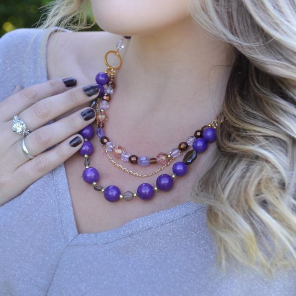 woman wearing purple necklace