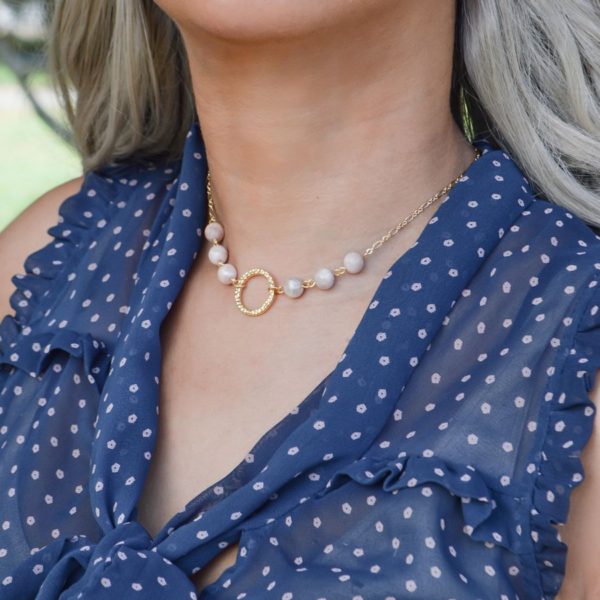 woman wearing sunstone necklace